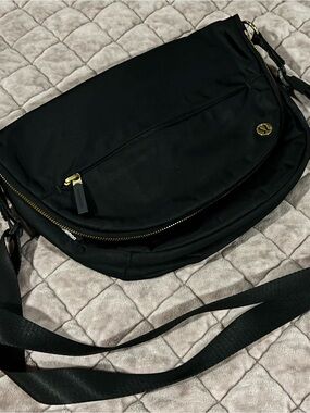 Lululemon Athletics Black Crossbody Sling with Gold Accents